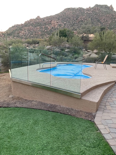 bottom framed glass pool fence and mountain views