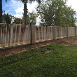 iron fence and block wall around a large acreage property