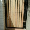natural wood and iron side yard gate