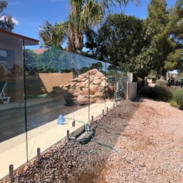 side view of glass fencing for pool