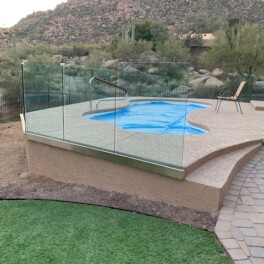 bottom framed glass pool fence and mountain views