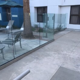 glass fence installation for hotel pool