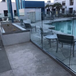 Glass pool fence installation at large hotel
