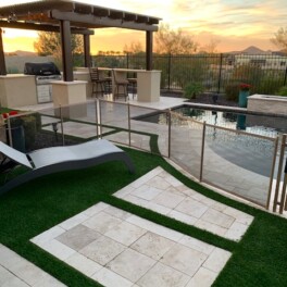 Pet fence installed around pool area with pergola