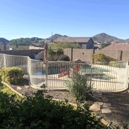 white iron pool fence with curves