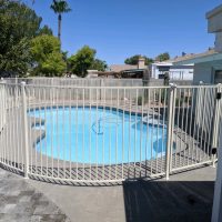 white wrought iron pool fence