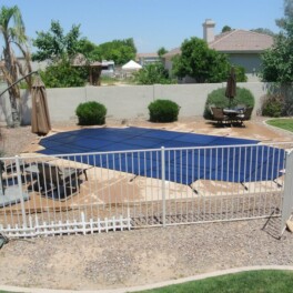 mesh pool safety cover and iron fence for protection