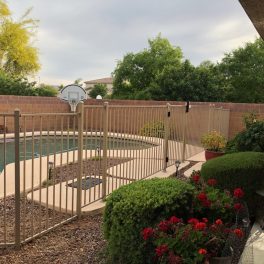 tan iron pool fence level changes