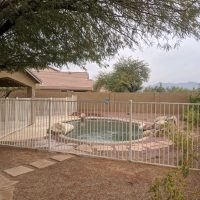 white wrought iron pool fence