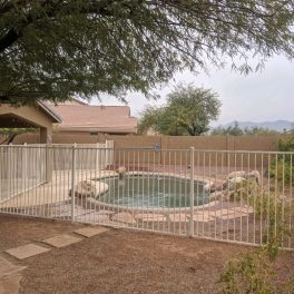 white wrought iron pool fence