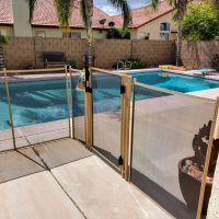 pool fence with self-closing and locking safety gate